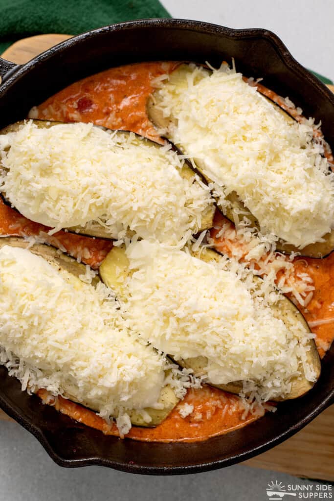 Chicken is topped with cheese to make Chicken Sorrentino.