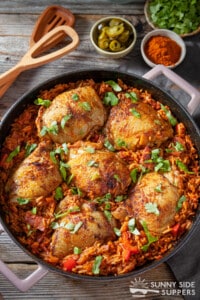 A skillet filled with Mexican chicken and rice.